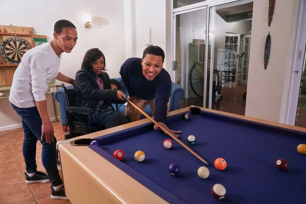 Group of friends playing pool